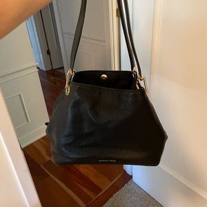 Michael Kore’s black satchel
